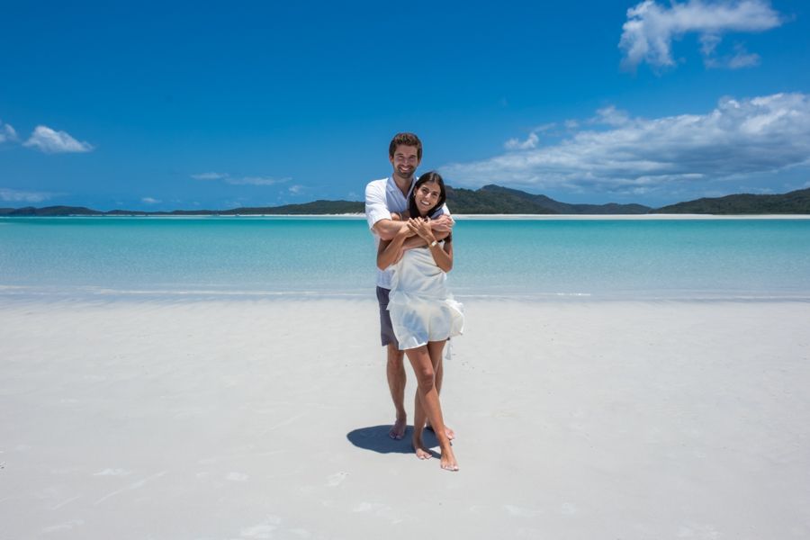 Whitehaven Beach couple posing on whitehaven beach whitsundays