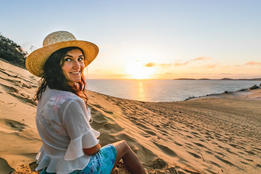 girl smiling on the carlo sand blow rainbow beach