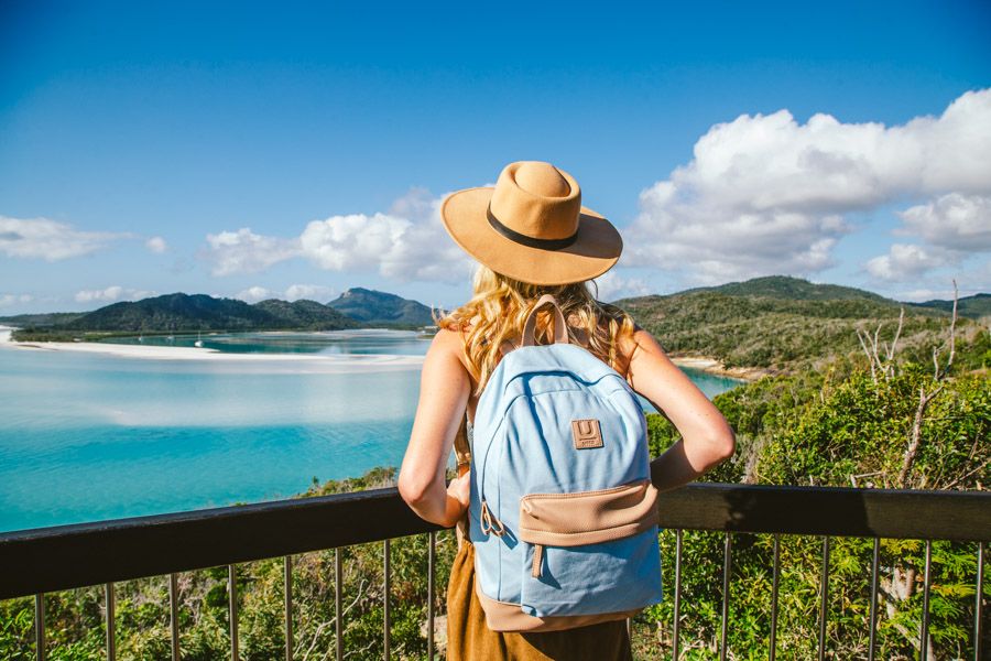 Girl with a blue backpack at Hill Inlet Lookout, Whitsundays, Australia