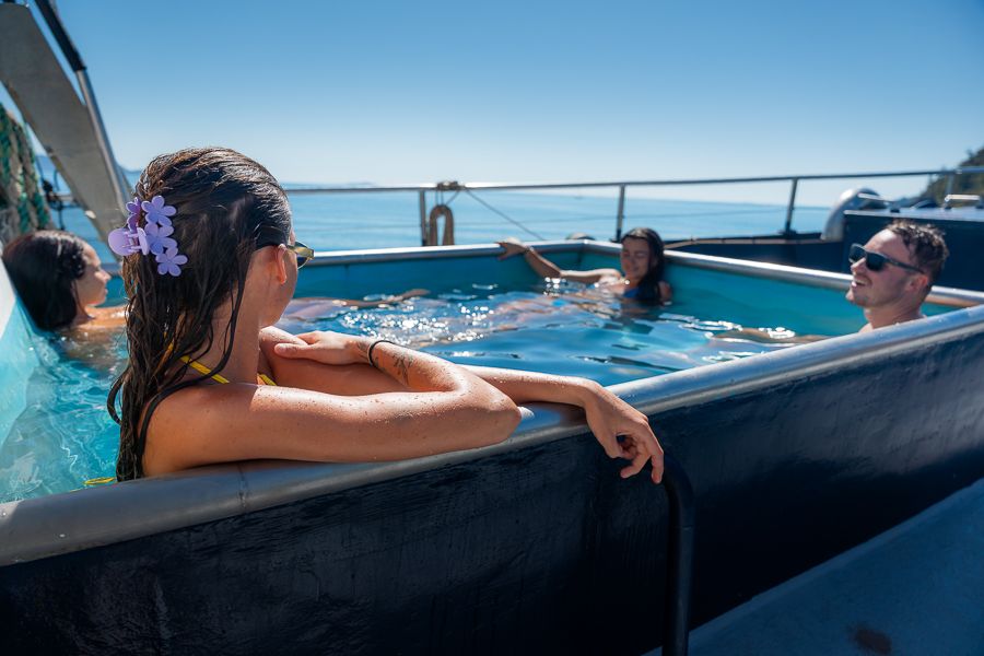 people relaxing in spa onboard atlantic clipper