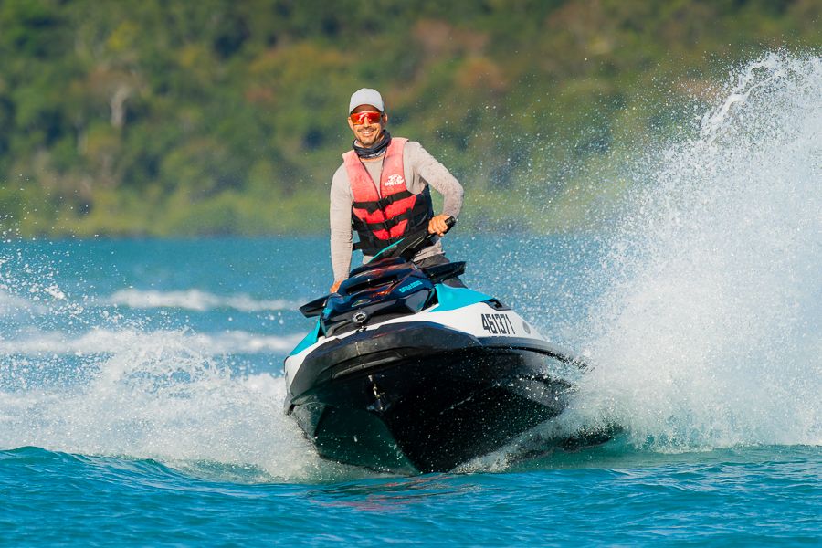 a man on a jetski travelling at speed