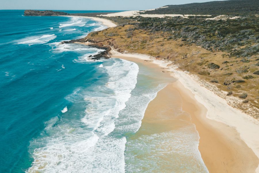 K'gari coastline with blue water and golden beaches