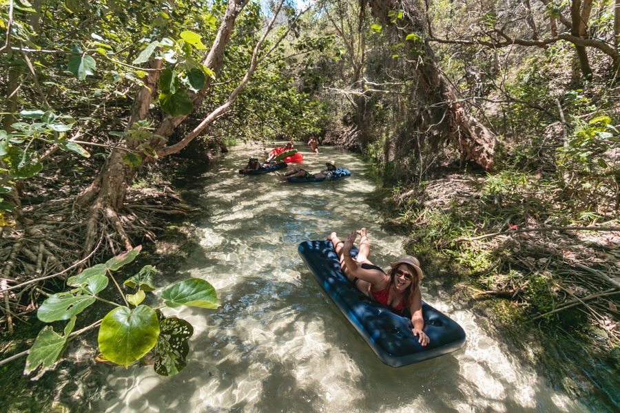 people floating down Eli Creek on flotation devices