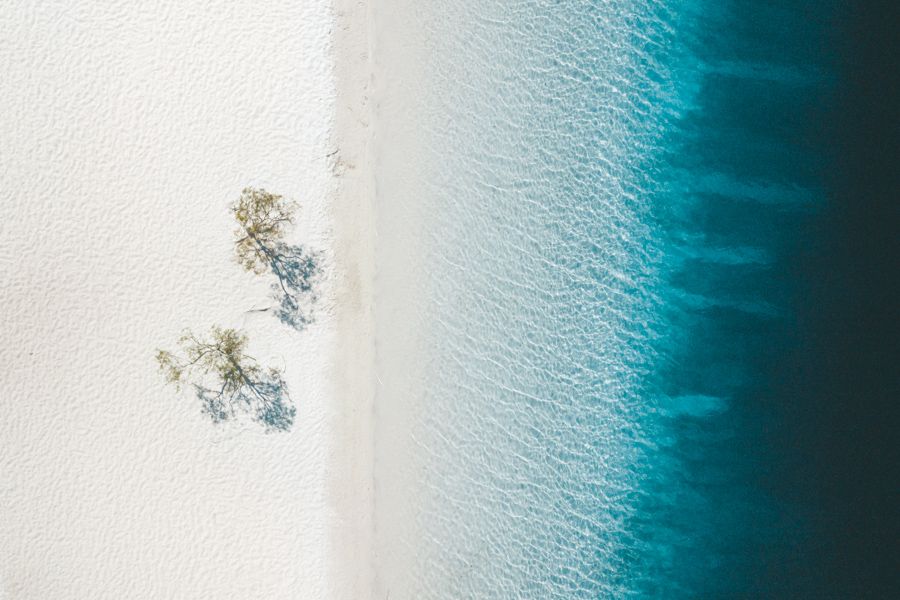 aerial view of Lake McKenzie's blue water and white sand