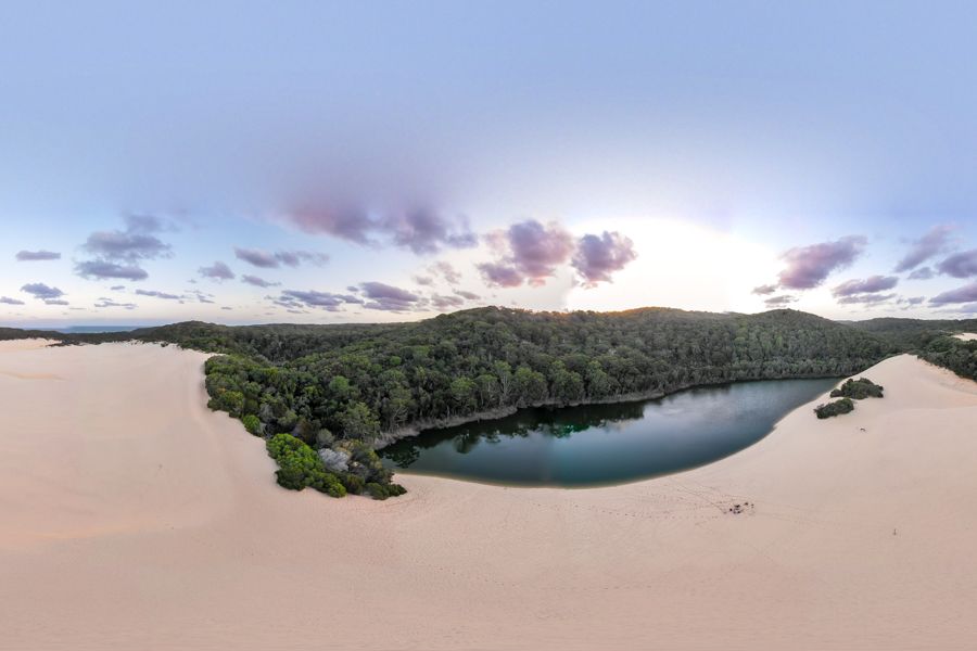 aerial view of emerald green dune lake on K'gari