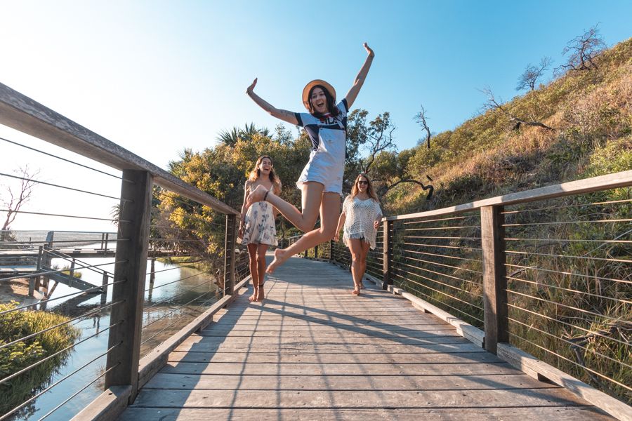 travelers exploring the Eli Creek Bridge, Fraser Island