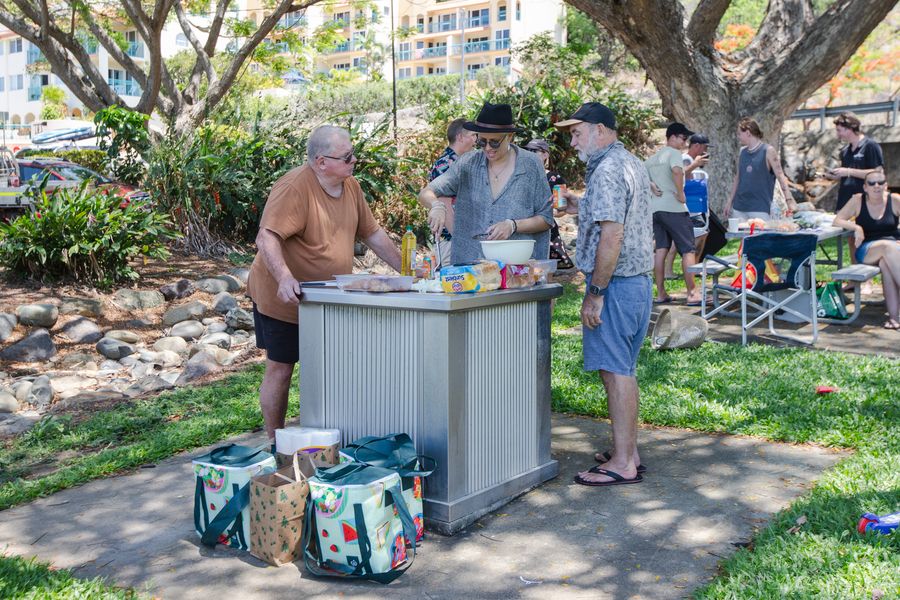 People using a public barbecue in Airlie Beach