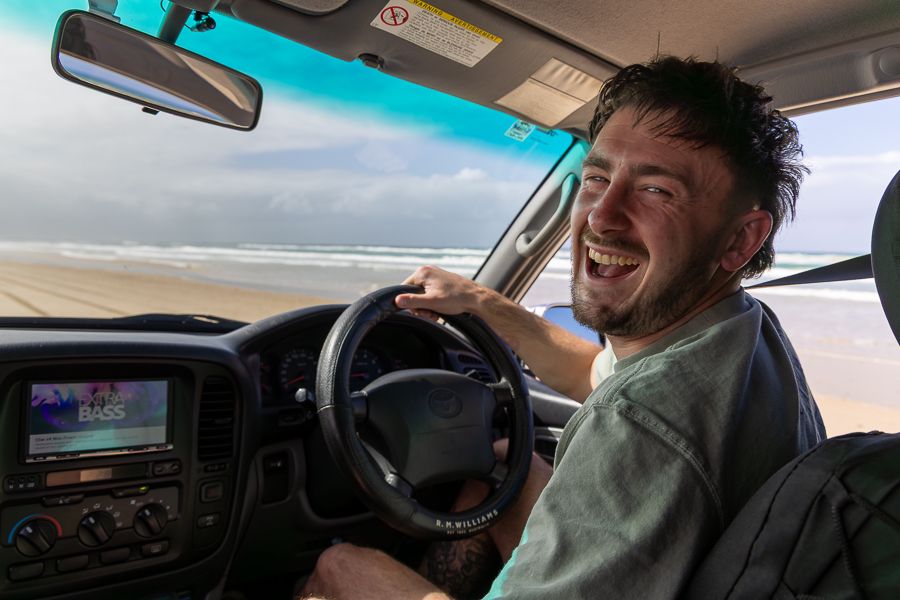 man driving a 4wd vehicle on kgari fraser island