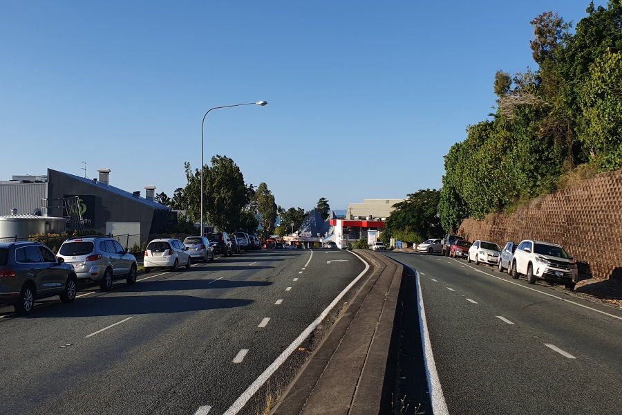 A main road with cars parked on either side