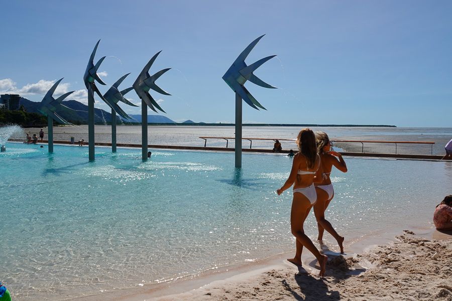 Two women strolling into the Cairns Esplanade Lagoon, Cairns