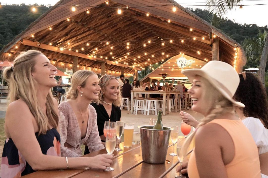 Group of people enjoying a drink at Northerlies Beach Bar and Grill