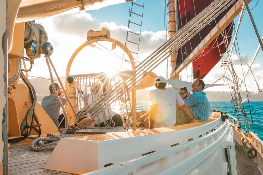 people laughing on deck in the whitsunday islands sailing