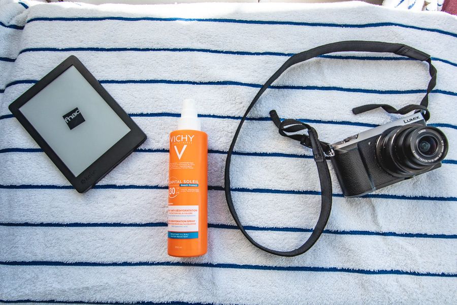 sunscreen and camera on a boat, whitsundays