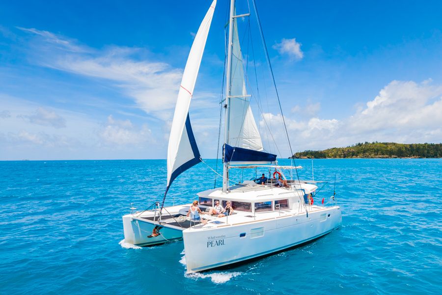 a sailing boat moving through the ocean