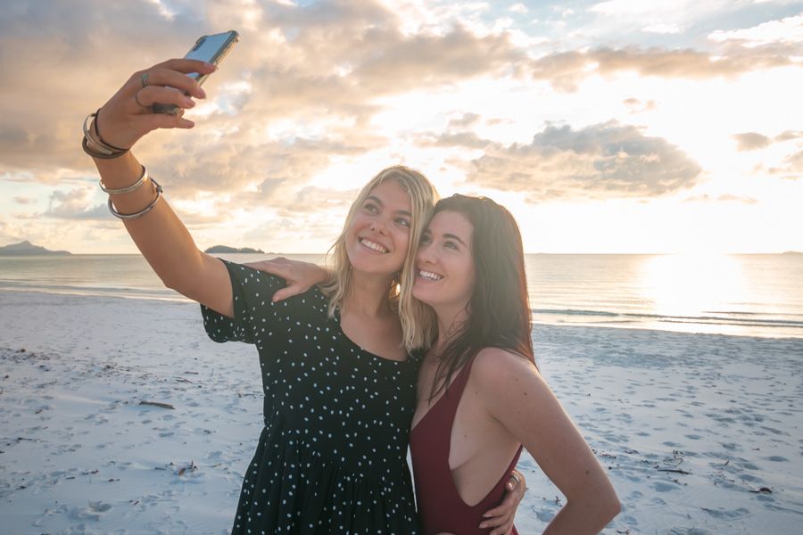 Whitsunday Island girls taking a selfie at the beach 