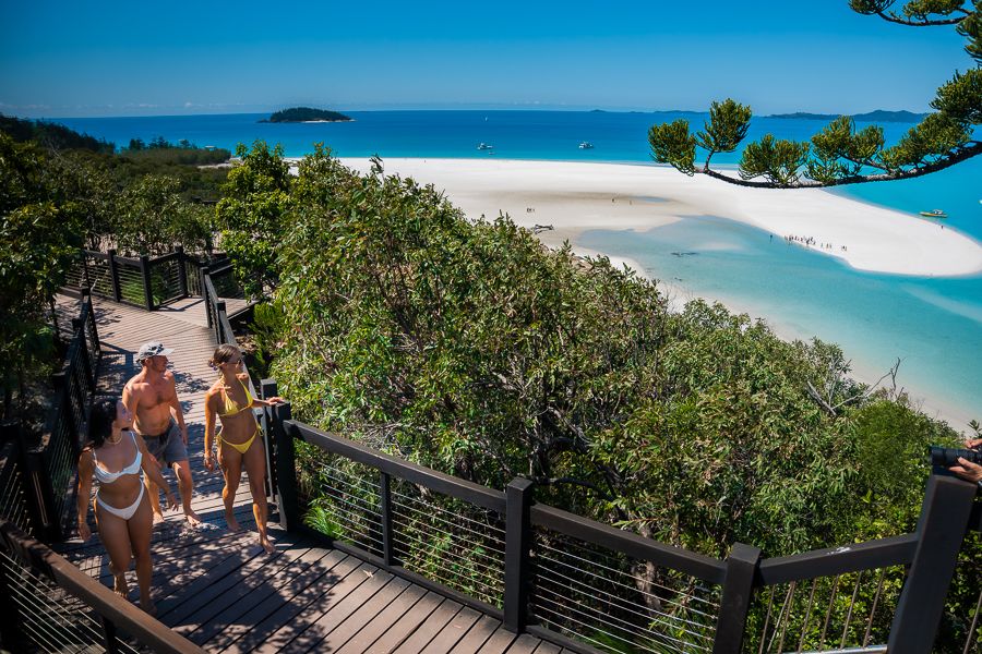 travellers walking along hill inlet lookout whitsundays