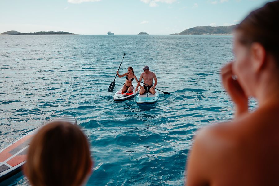 Two people on a SUP in the ocean