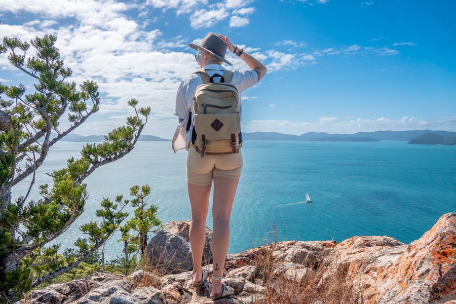 Person with a hat and backpack at Spion Kop walk on South Molle Island