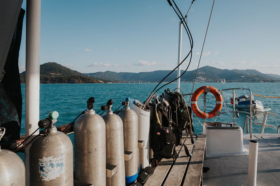 scuba gear onboard a dive boat in the whitsundays