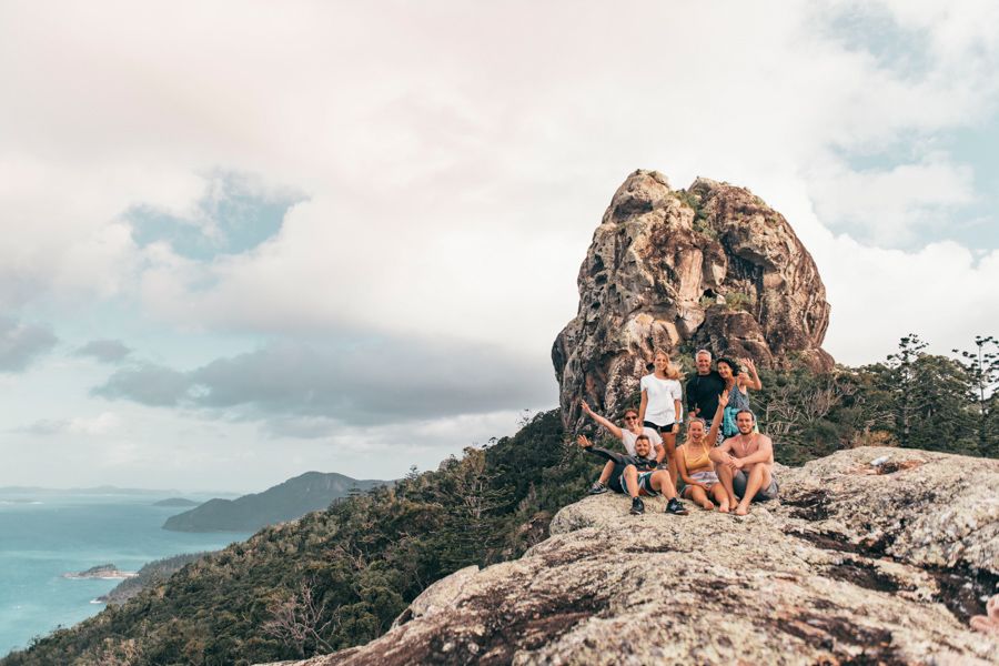 Group of people at the summit of the Whitsunday Cairn hike, Whitsundays