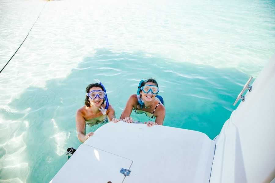 Two women wearing snorkel mask smiling, Whitsundays