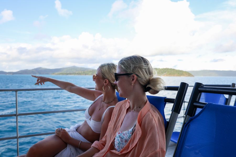 Two people on the Cruise Whitsundays passenger ferry to Hamilton Island