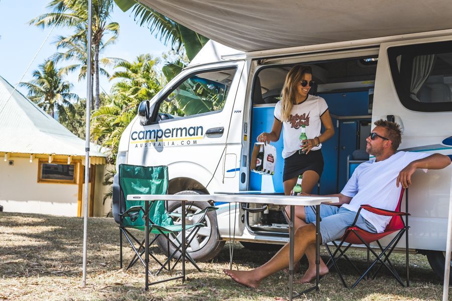 Camperman van hire, two people set up camp in the Whitsundays