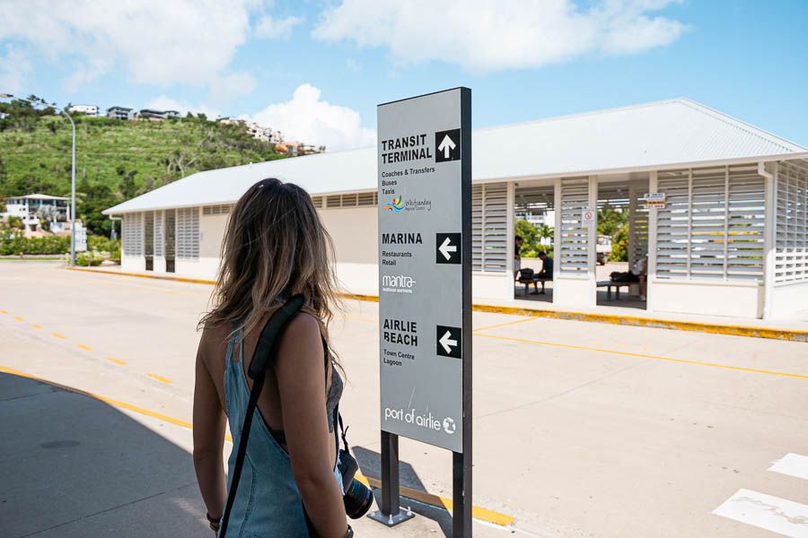 Women looking at the Port of Airlie signpost