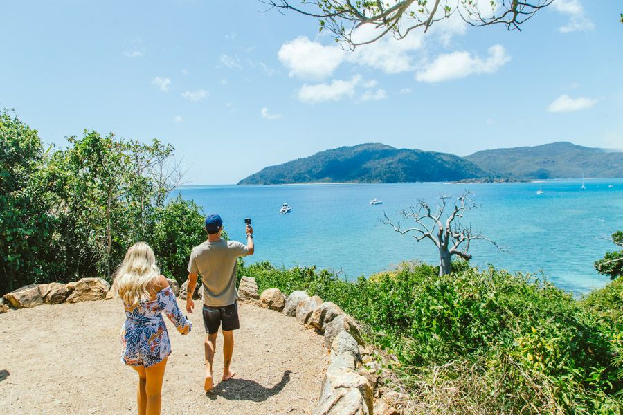 Two people at the summit of the Langford Island Track, Whitsundays