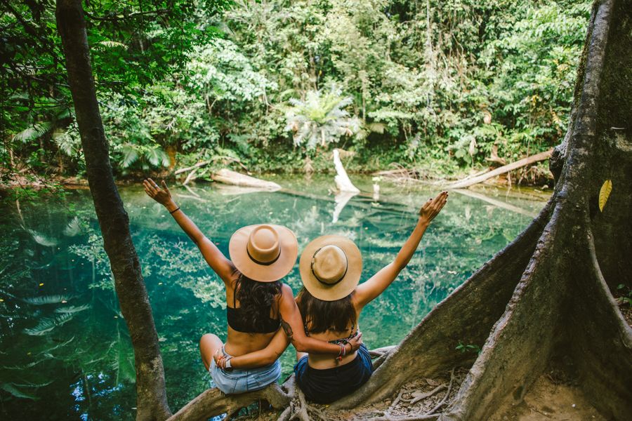 Two people about to go swimming at Blue Hole Daintree Rainforest, Cairns