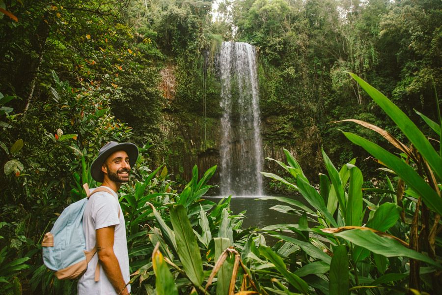 Person wearing a backpack at Millaa Millaa Fall Cairns