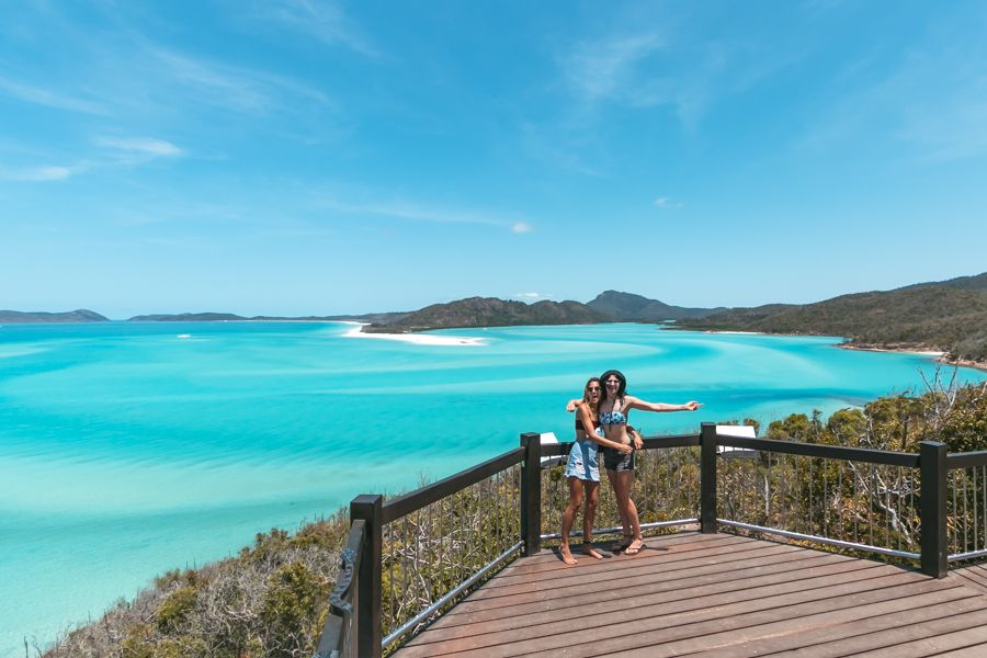 Two people smiling at Hill Inlet Lookout, Whitsundays