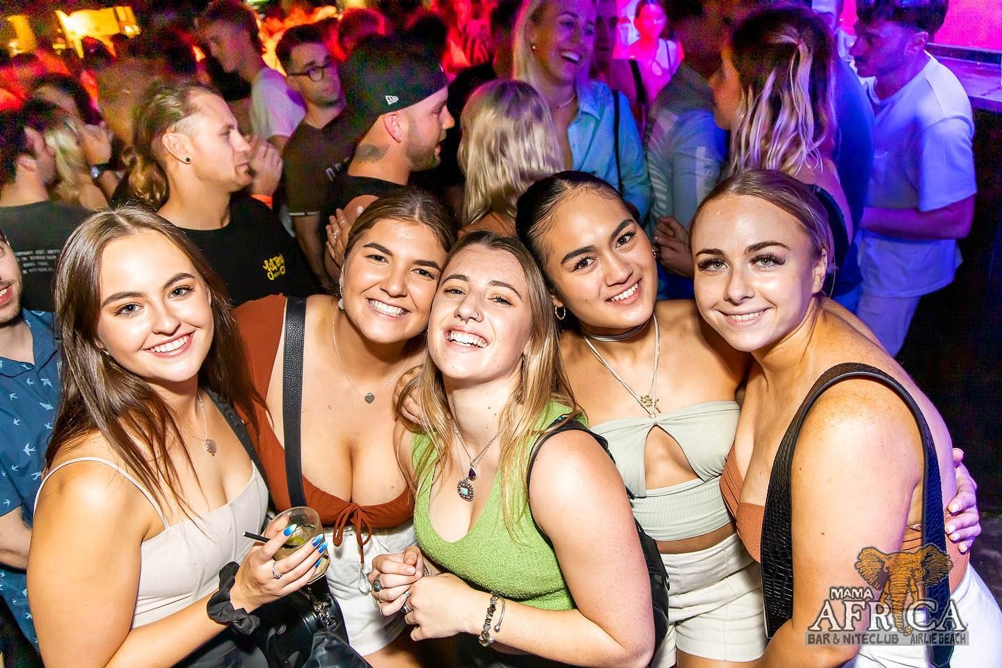 Girls standing together in a nightclub 