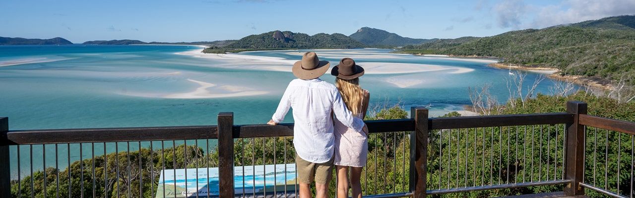 Couple looking out over the Hill Inlet at Whitehaven Beach