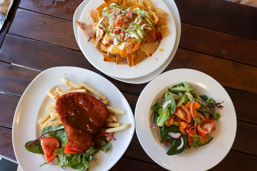 Hamilton island spread of lunch options, salad, parmy, chips