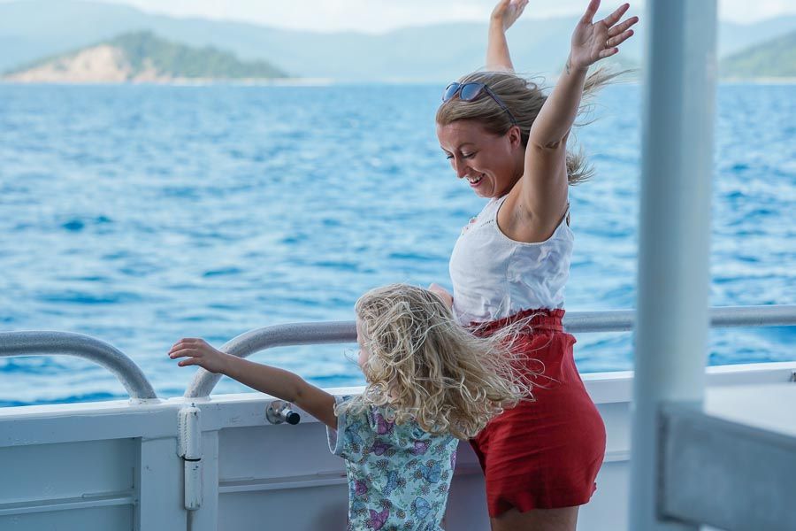 Women and a child on a boat in the Whitsundays