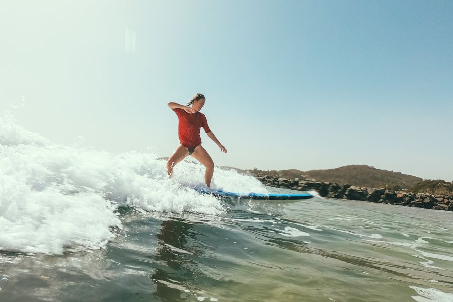 Noosa learn to surf woman standing up