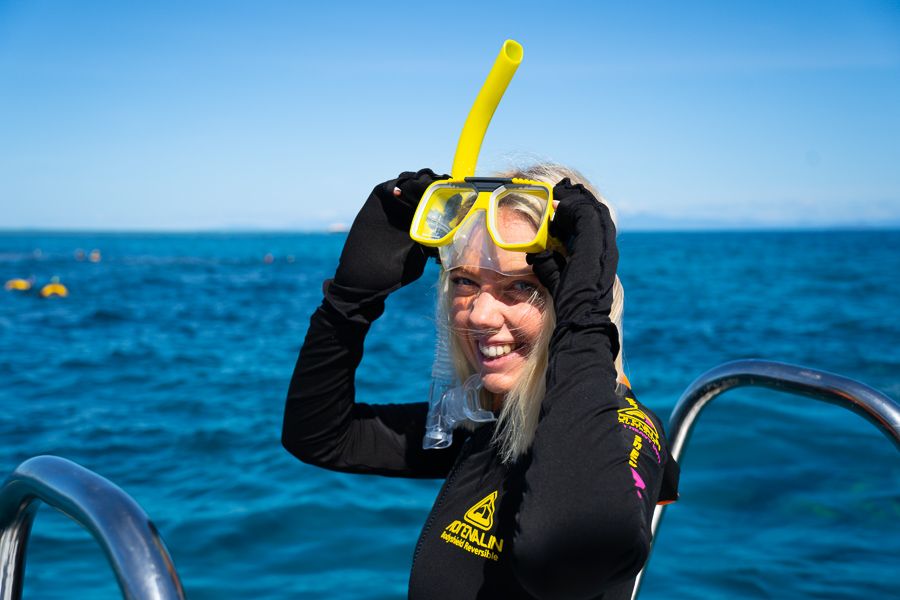 Women wearing a stinger suit and gloves on the Great Barrier Reef