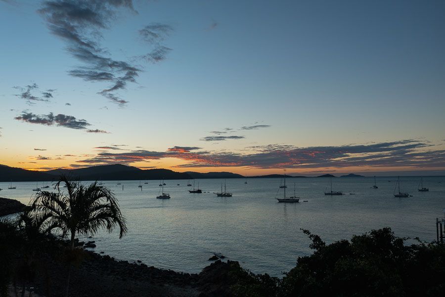 Airlie Beach at sunset with boats