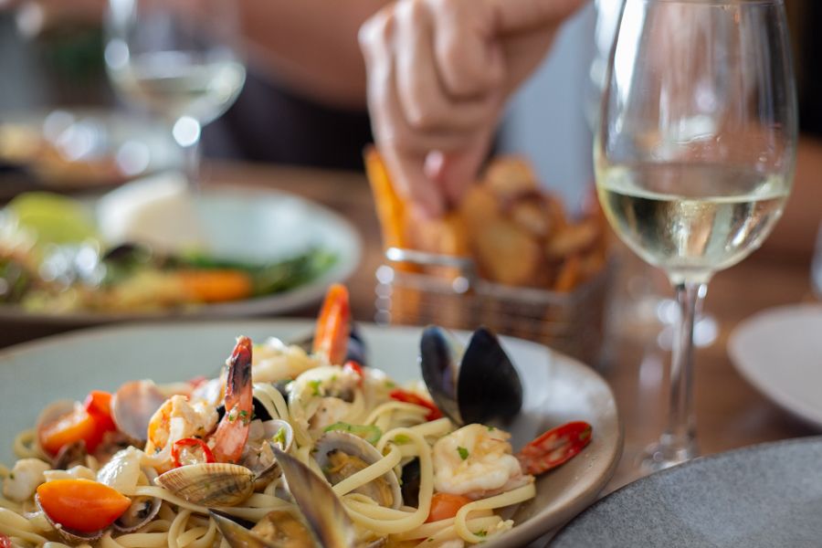 tucking into Seafood at a restaurant in Cairns