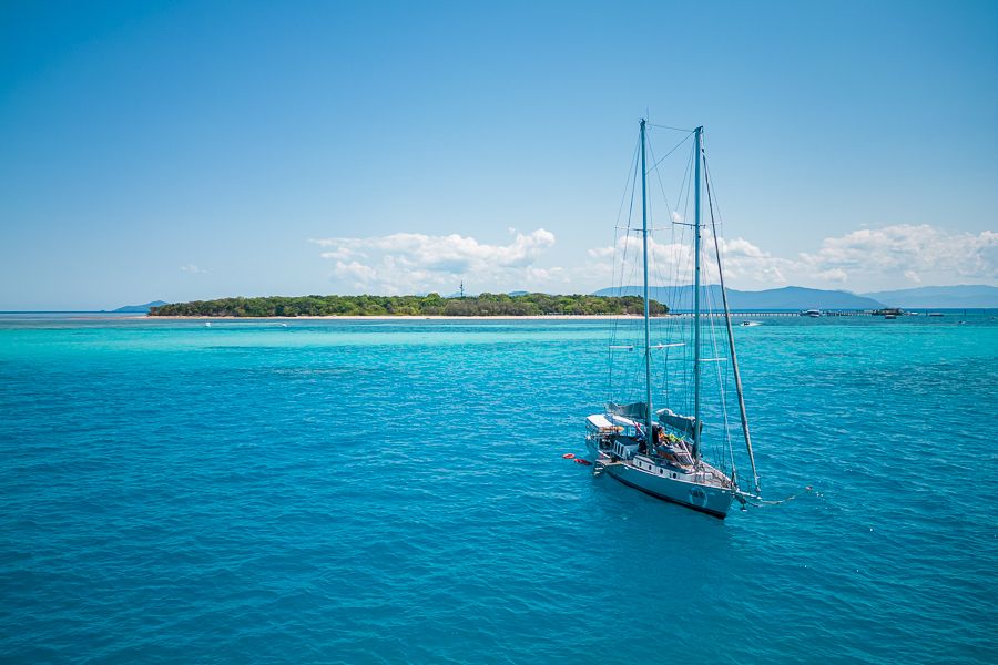 Ocean Free boat with green island in the background