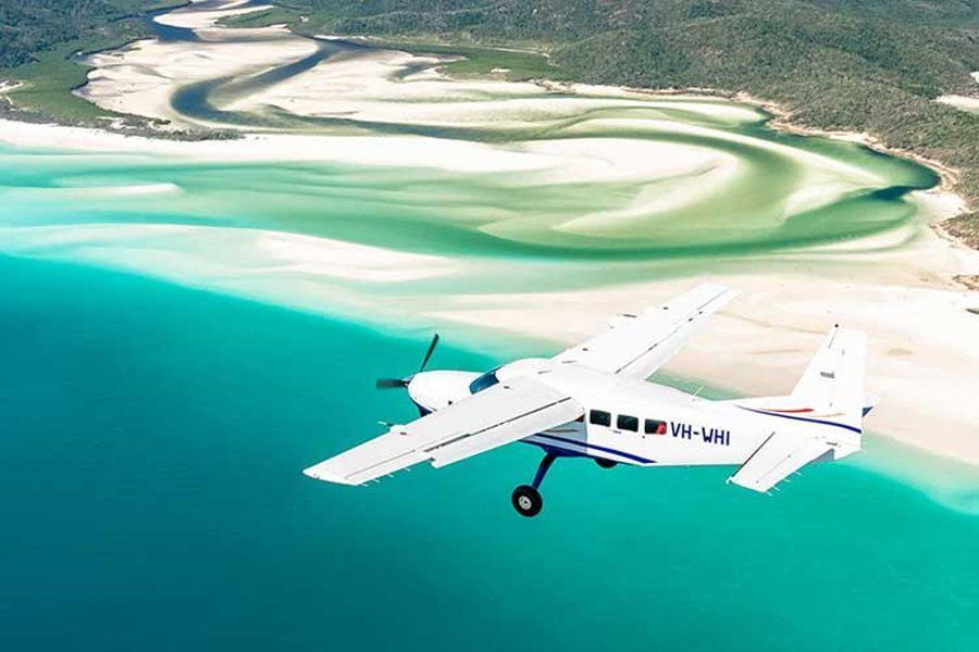 Small plane flying over Hill Inlet, Whitsundays