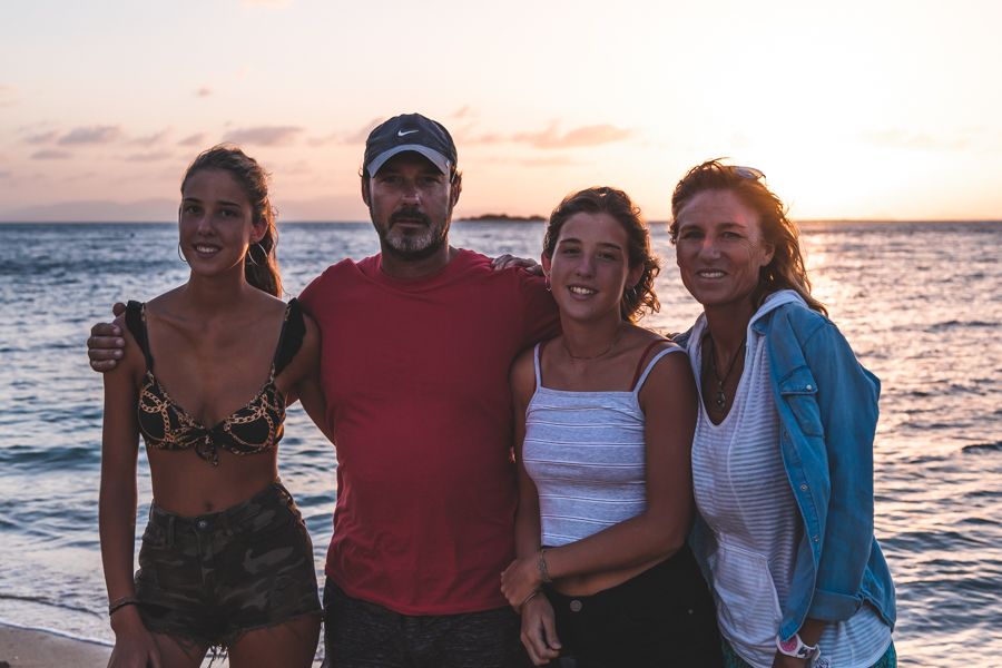 Family of four at sunset