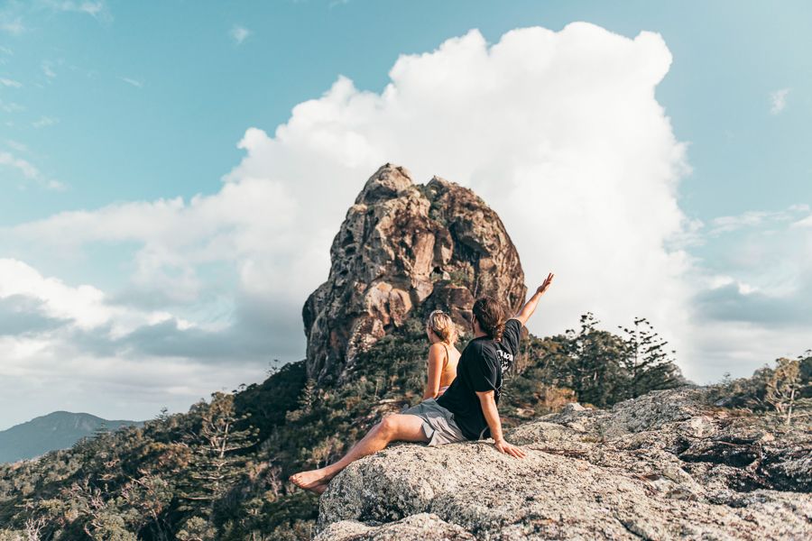 Two people at the peak of Whitsunday Cairn, Whitsundays Hikes