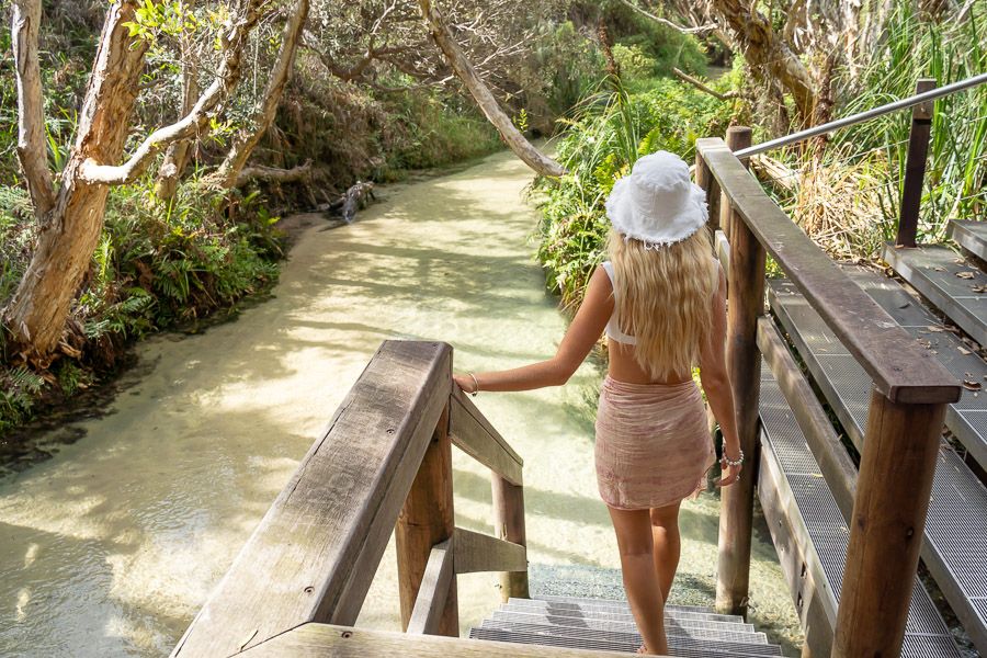 Woman walking into Eli Creek