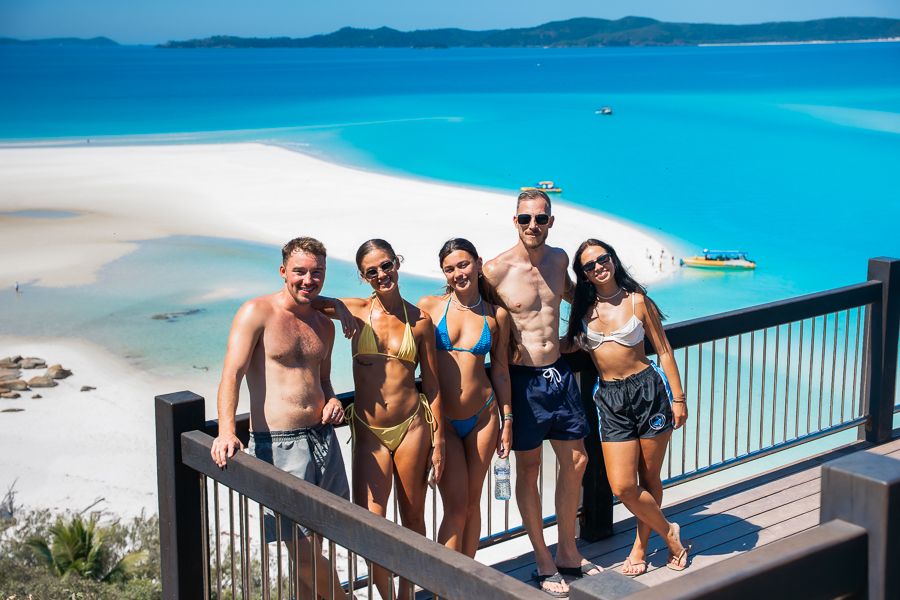 group of travellers posing in front of hill inlet whitsundays