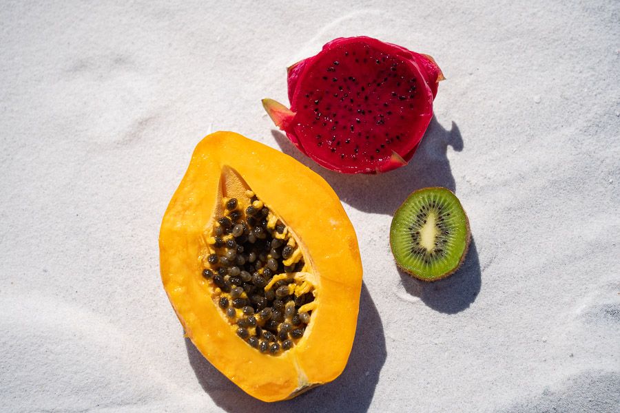 Various fruits on white sands