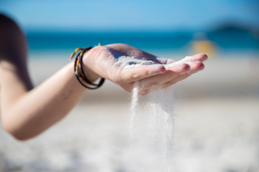 person holding sand