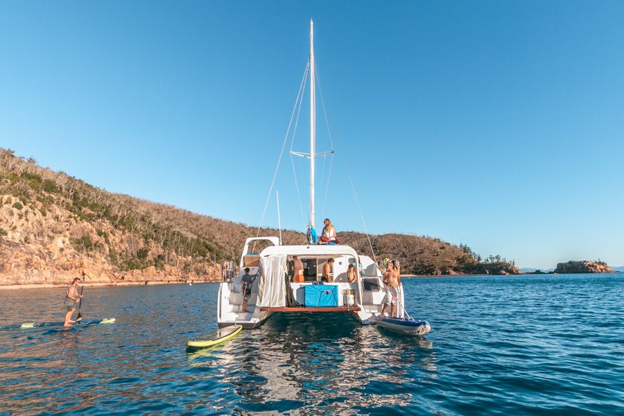 people on a tour boat near whitehaven beach