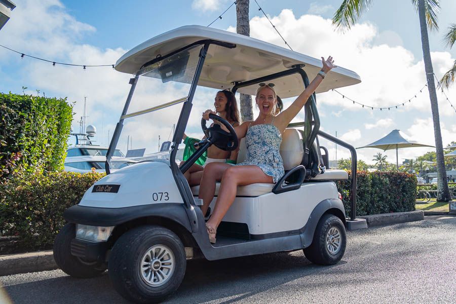 Two women driving a buggy on Hamilton Island